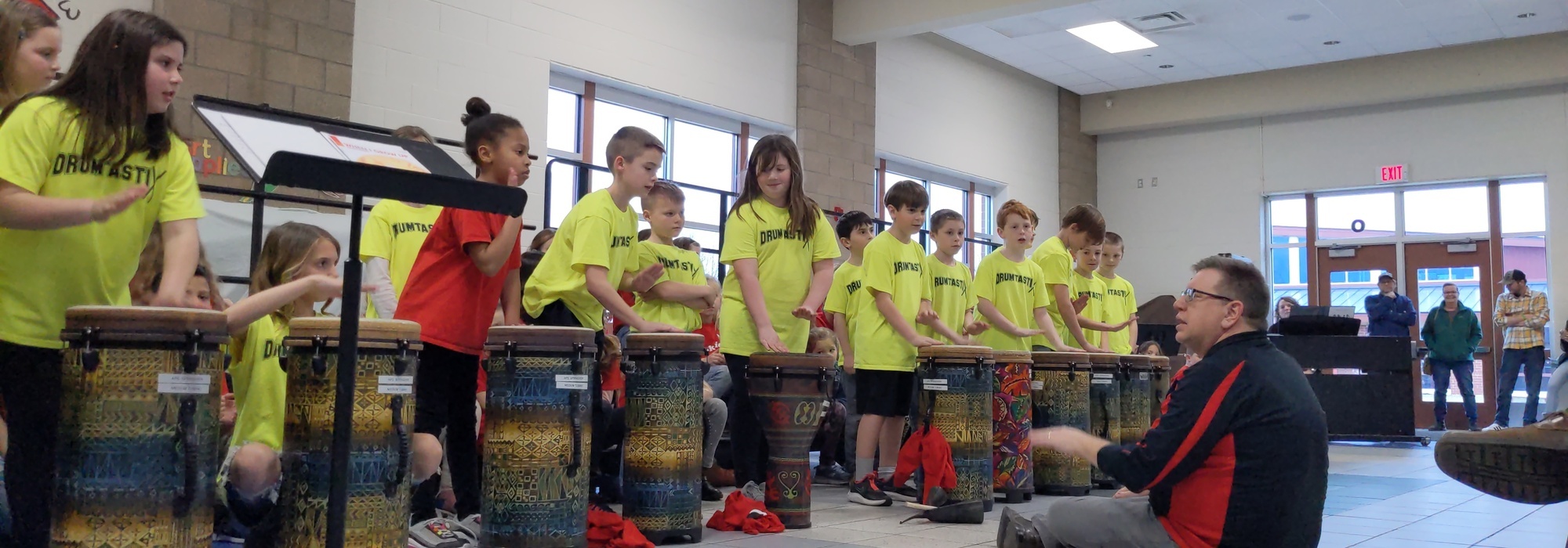 Elementary students playing drums